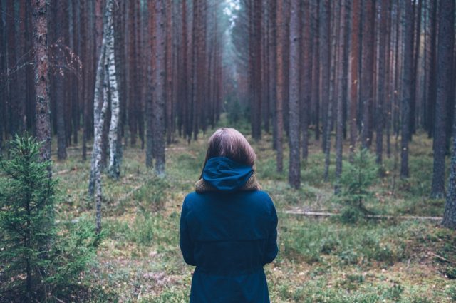young woman hiking in forest
